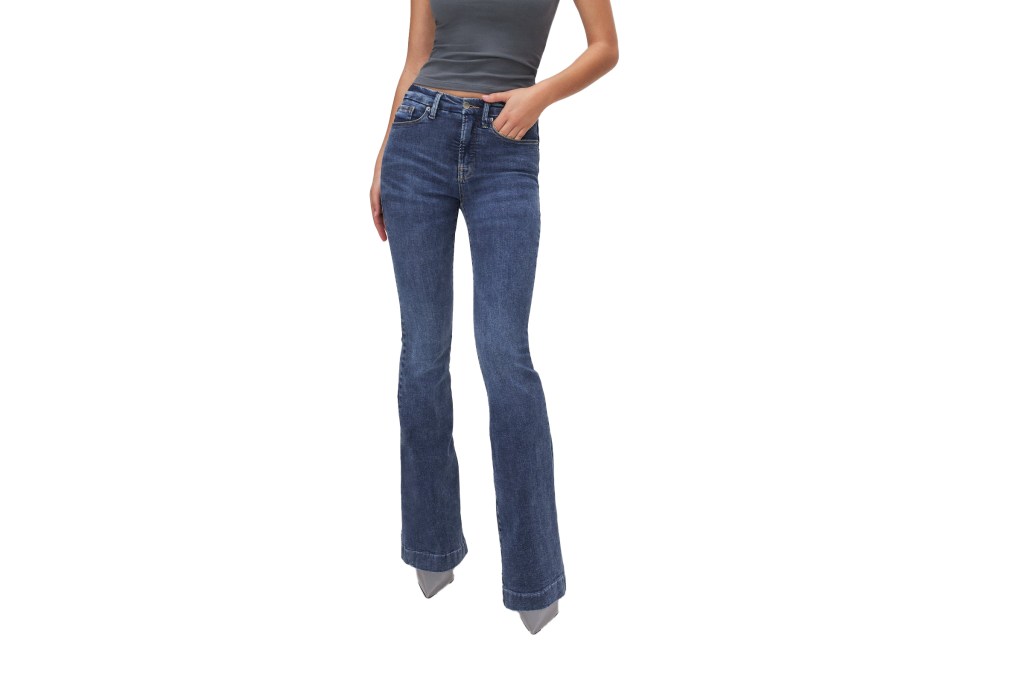 A woman wearing blue jeans with the title 'Good American'